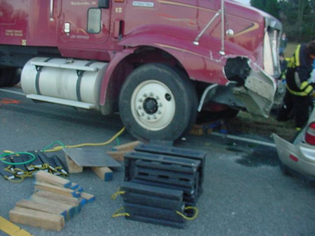 DSC00025 North Meck Rescue had to lift the Cab of the Tractor up to pull the car out from under it.